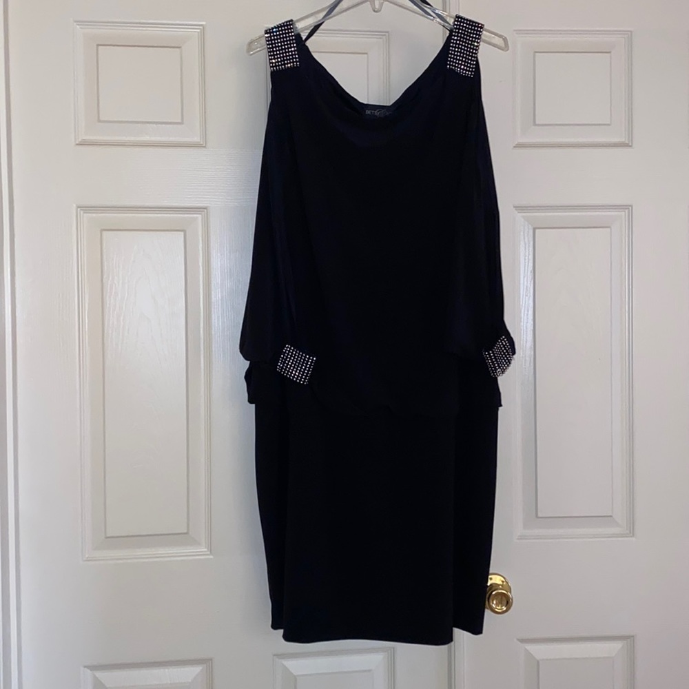 Open 3 quarter sleeve black dress. Never worn.